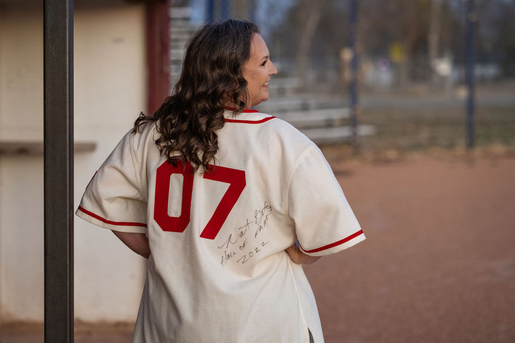 Robyn Jensen wearing a Rockets Jersey with the number 7 on back and signed by Nat Bates.